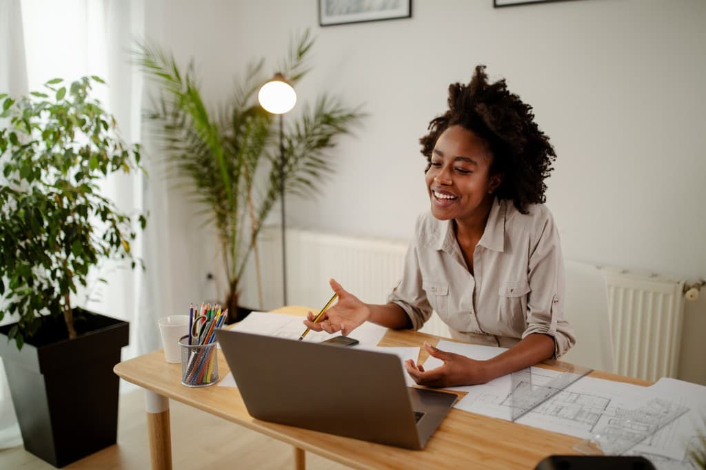 Jamaican remote worker at laptop